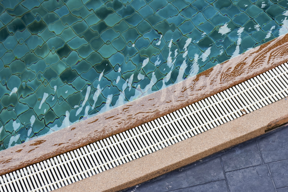 Close,Up,Of,Refreshing,Blue,Water,Flowing,Over,Swimming,Pool